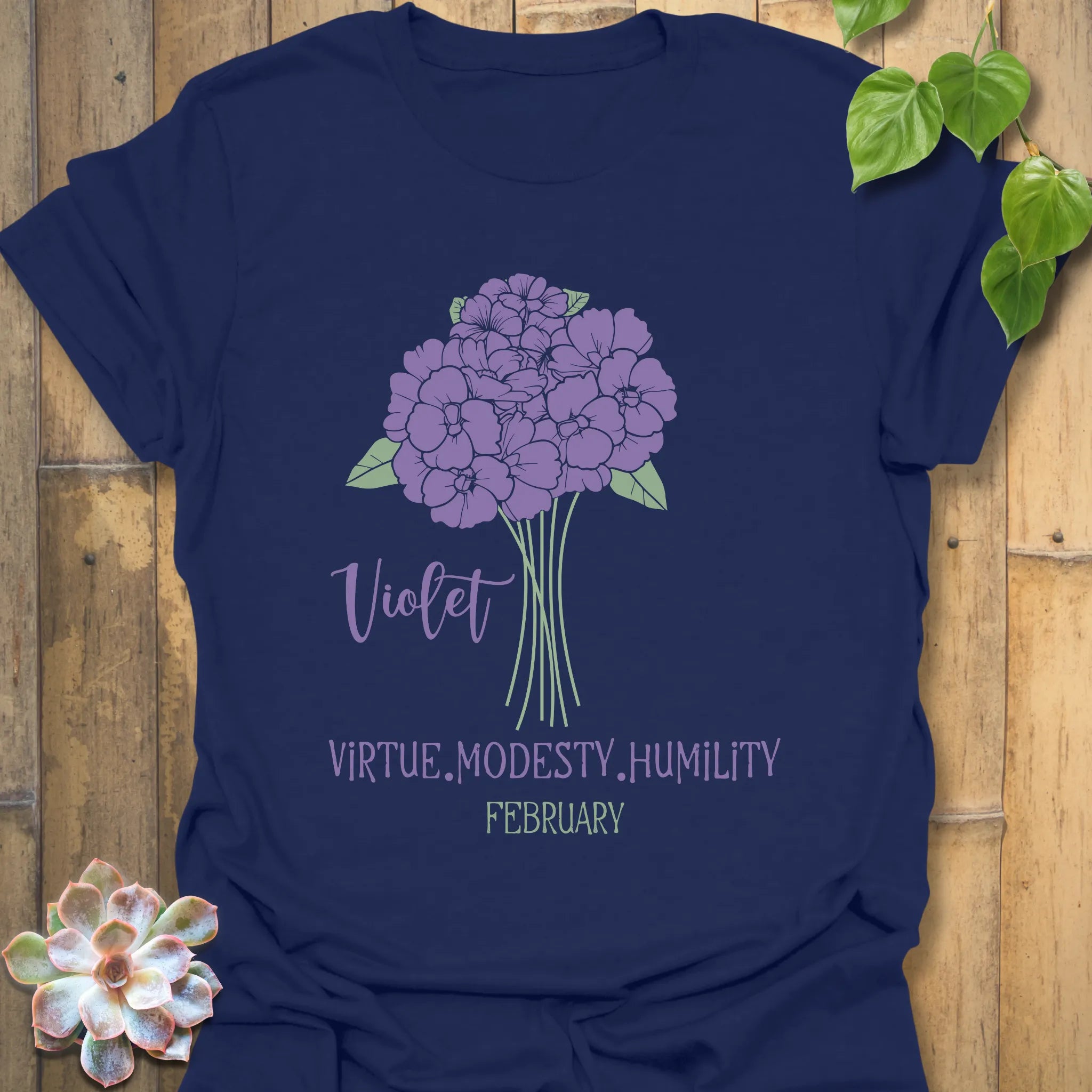 Navy t-shirt featuring the design February Violet with a rose flower print, a versatile botanical flower graphic tee for everyday style.