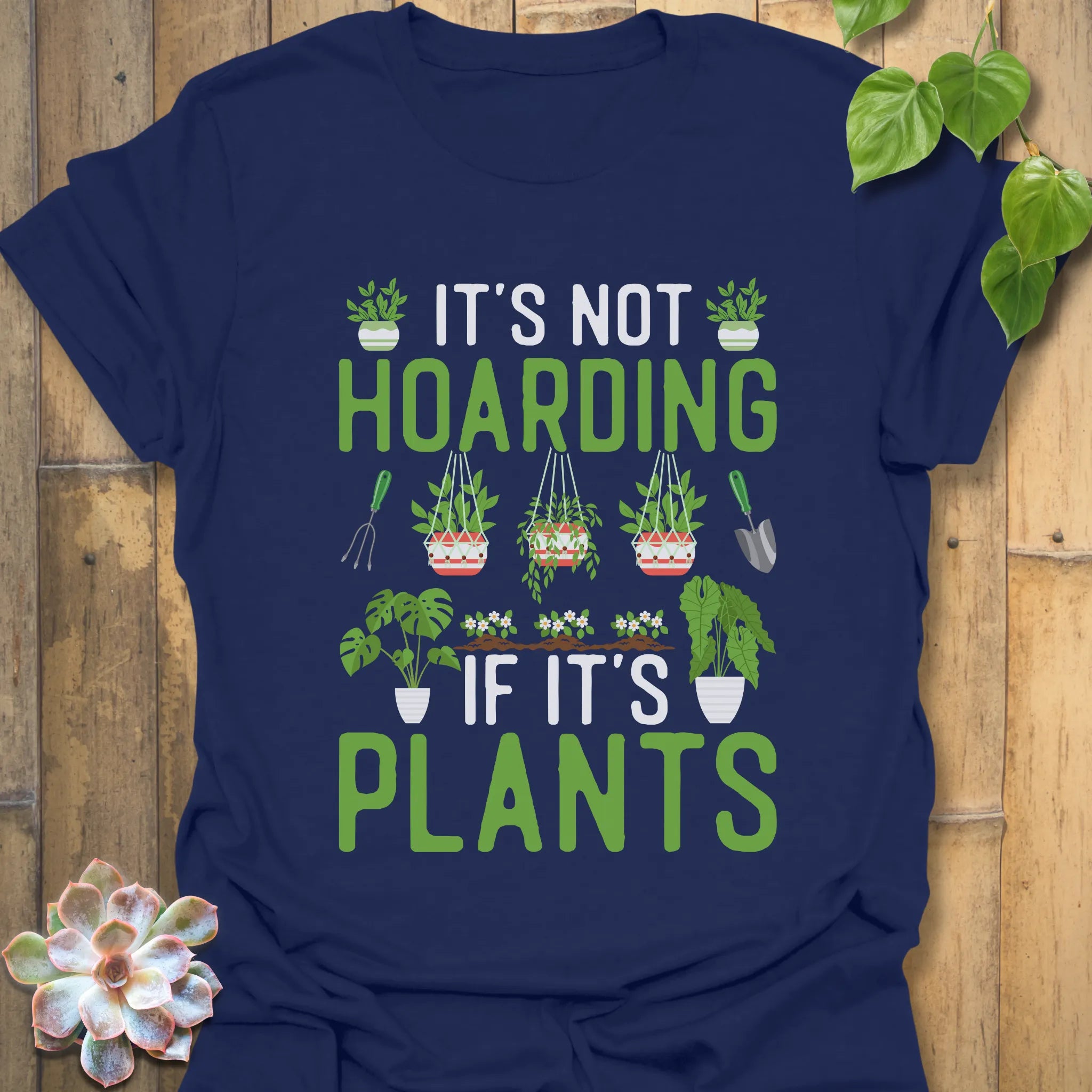 Navy t-shirt featuring the design It’s Not Hoarding If It’s Plant with plant lover graphic.