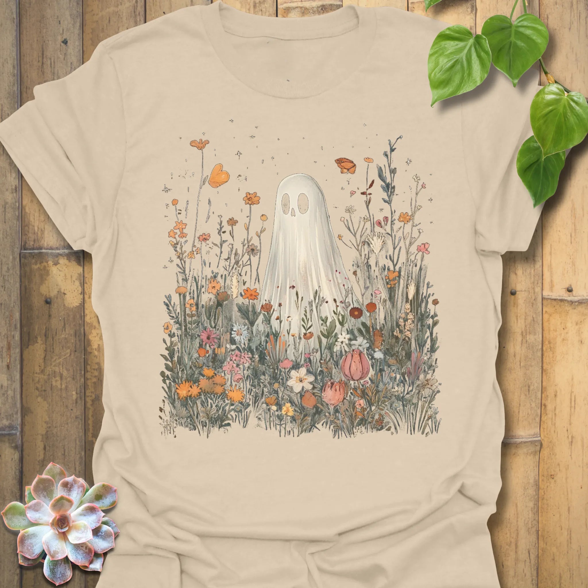 Sand t-shirt featuring the design Among The Wildflowers printed in halloween floral graphic tee
