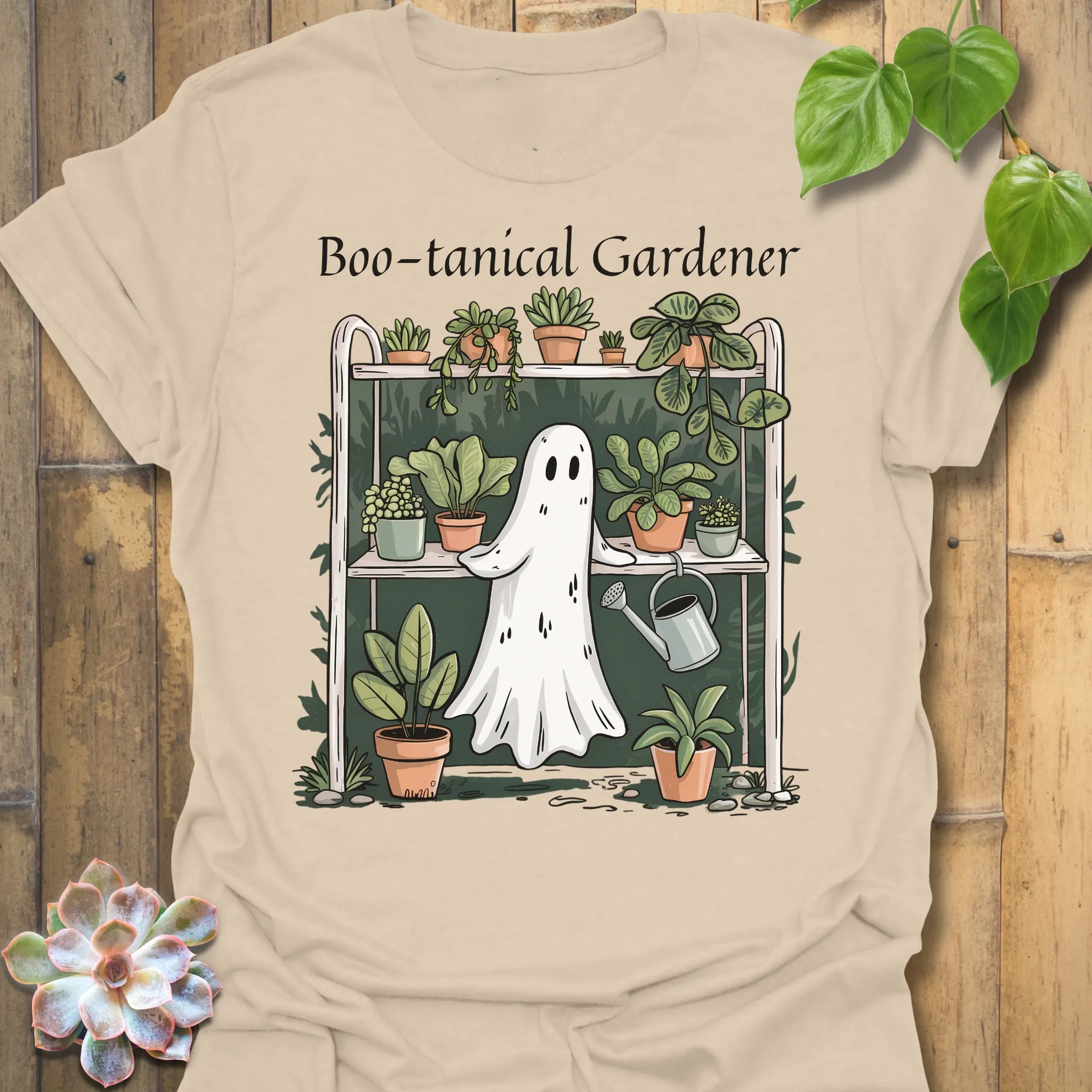 Sand t-shirt featuring the design Boo – Tanical Gardener printed in bold Halloween gardening shirt.