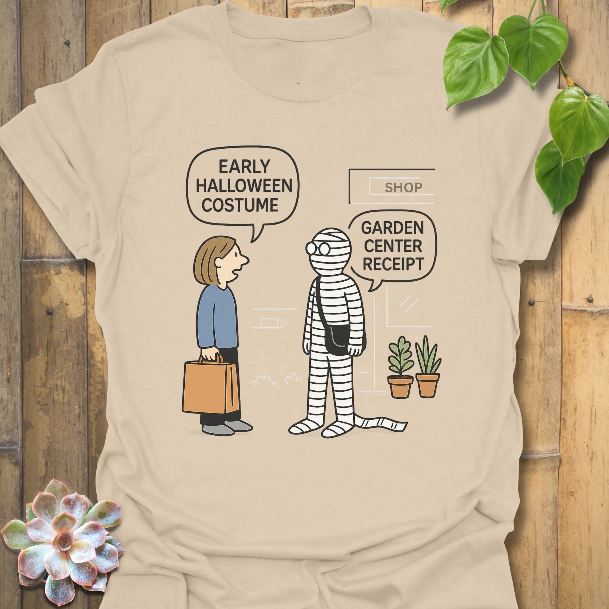 Sand t-shirt featuring the design Halloween Costume printed in bold letters, stylish Halloween top.