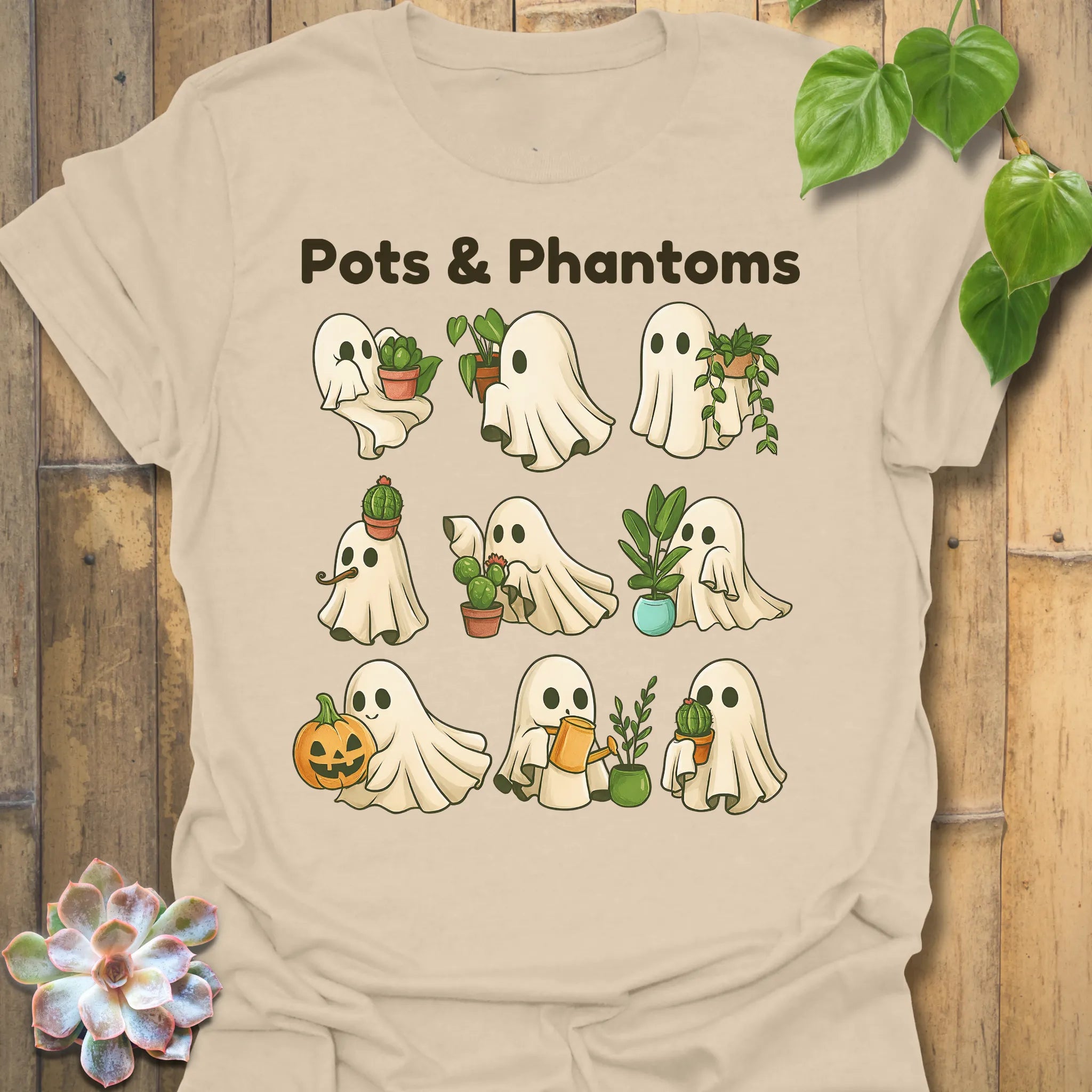 Sand t-shirt featuring the design Pots & Phantom printed in bold black letters, halloween graphic shirt