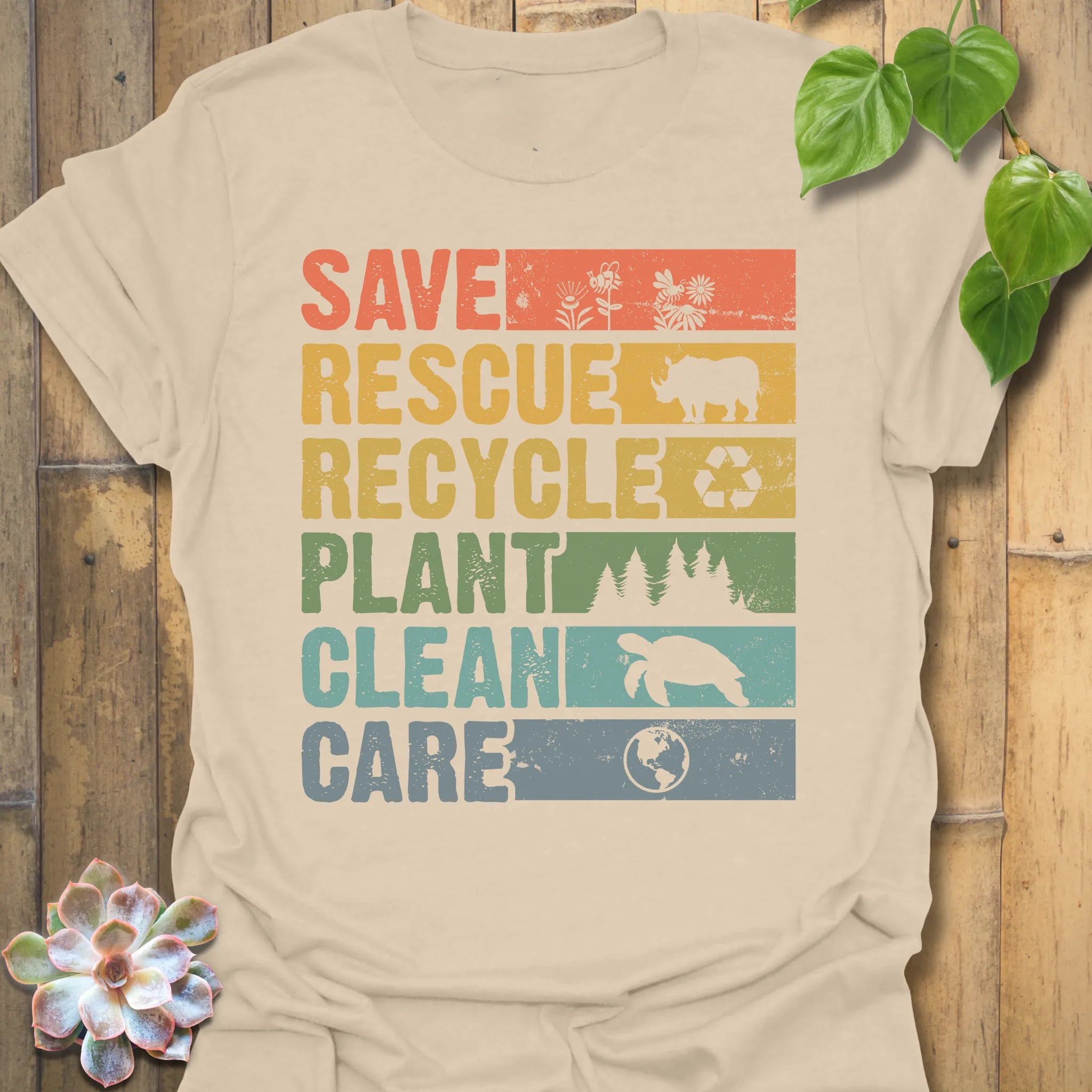 Sand t-shirt featuring the design Save, Rescue printed in bold colorful letters, plants, nature, animal lover tee.
