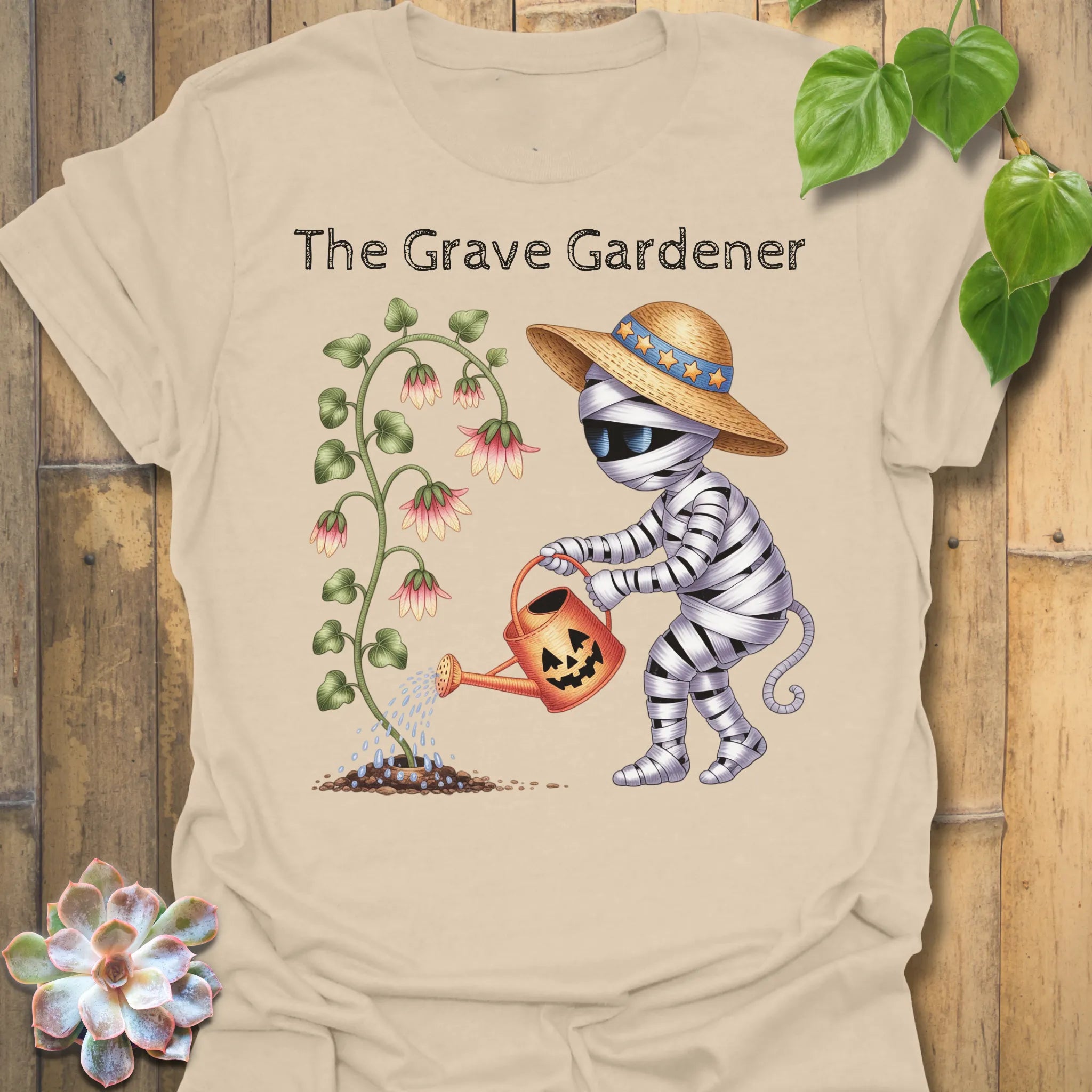 Sand t-shirt featuring the design The Grave Gardener printed in halloween plant shirt.
