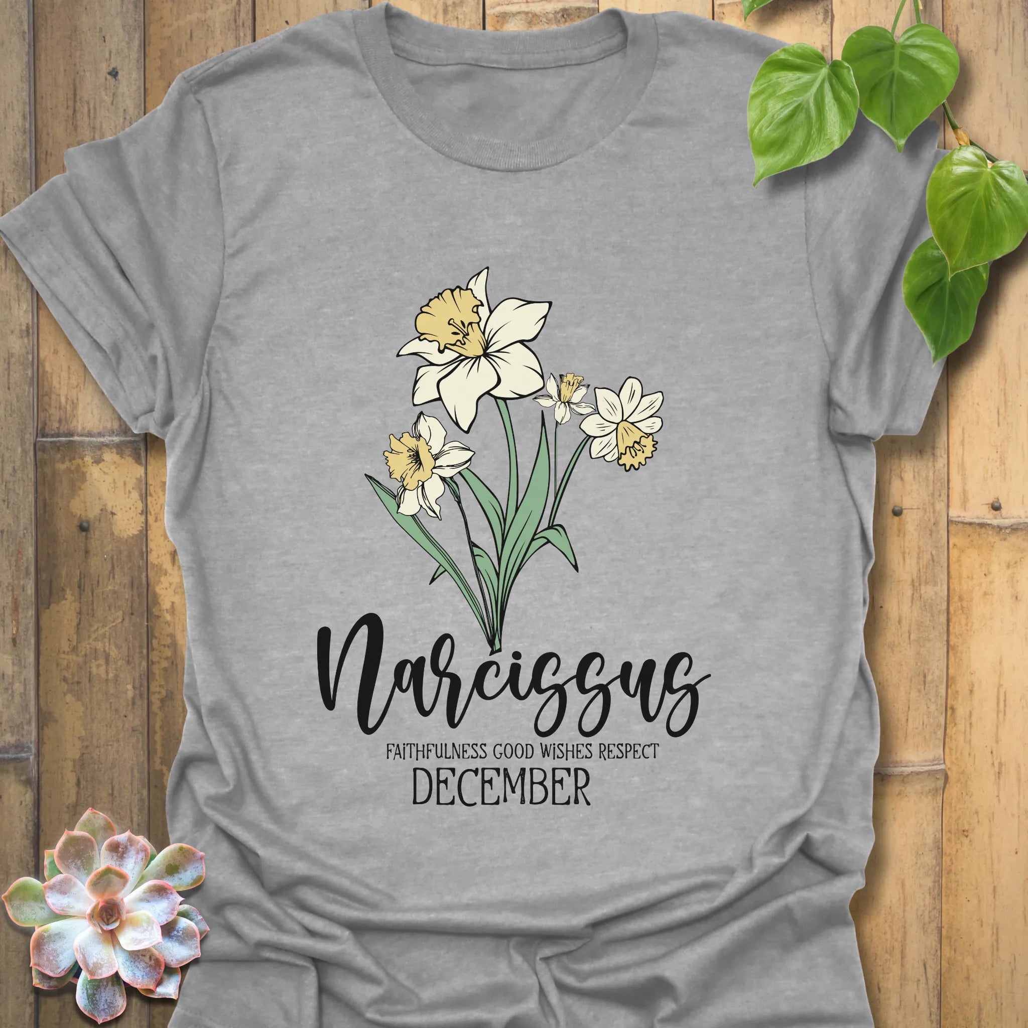 Sport Grey t-shirt featuring the design December Narcissus highlighting a narcissus flower illustration, a casual floral graphic tee with botanical style
