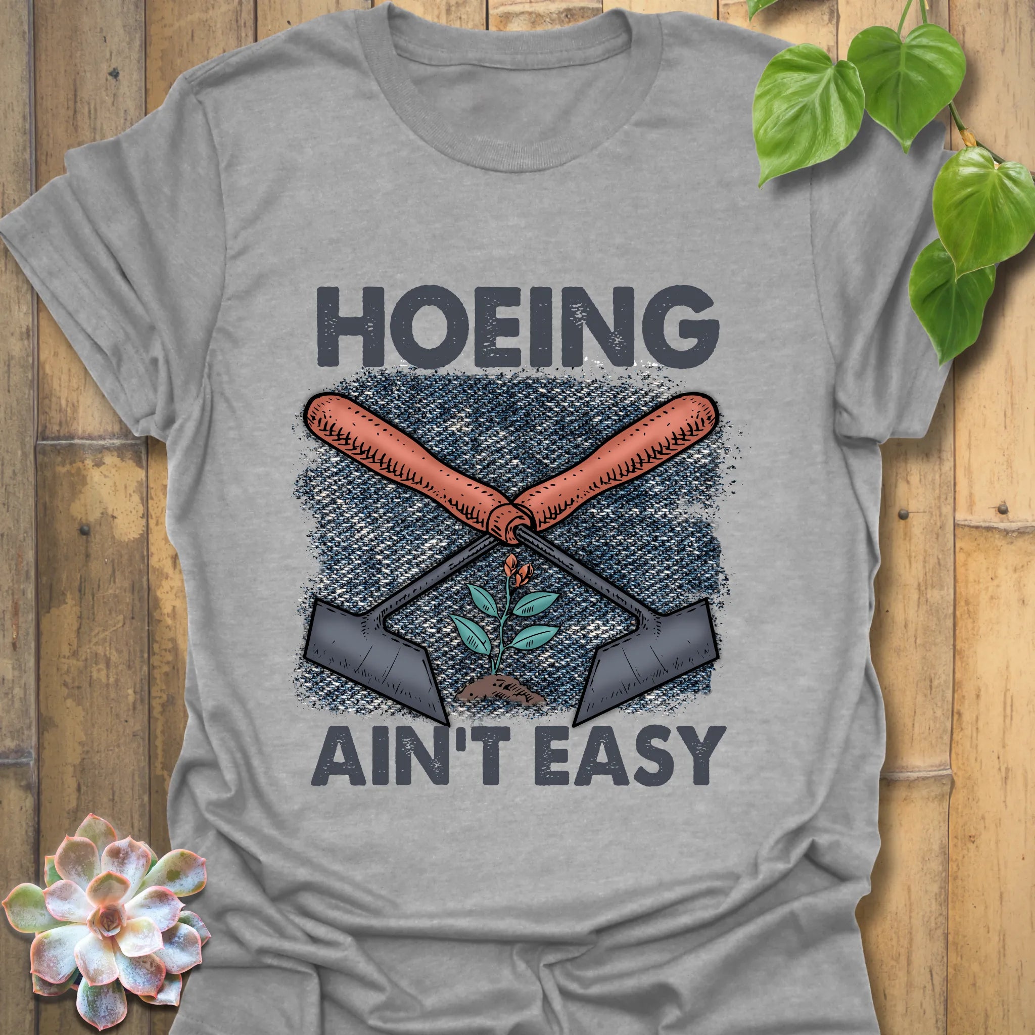 Sport Grey t-shirt featuring the design Hoeing Ain’t Easy, casual garden lover shirt.