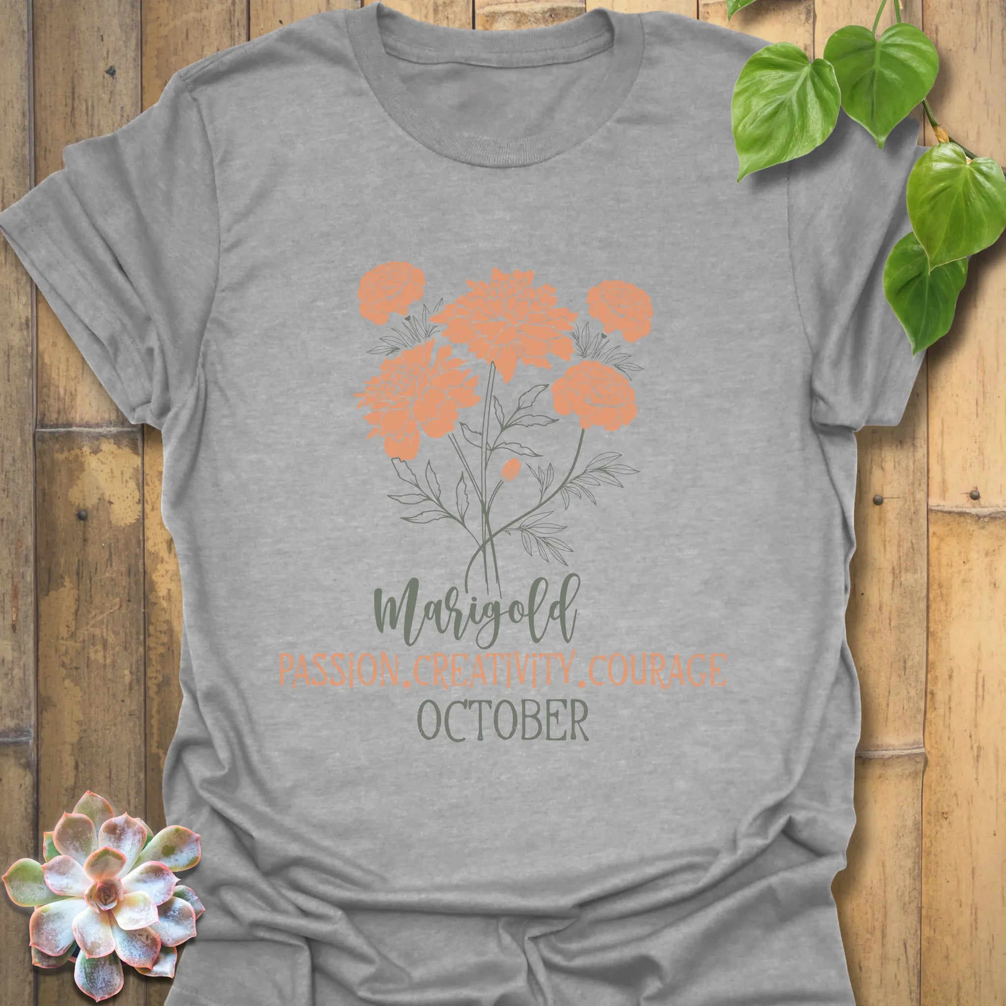 Sport Grey t-shirt featuring the design October Marigold printed with a bold marigold flower, a casual graphic flower t-shirt.