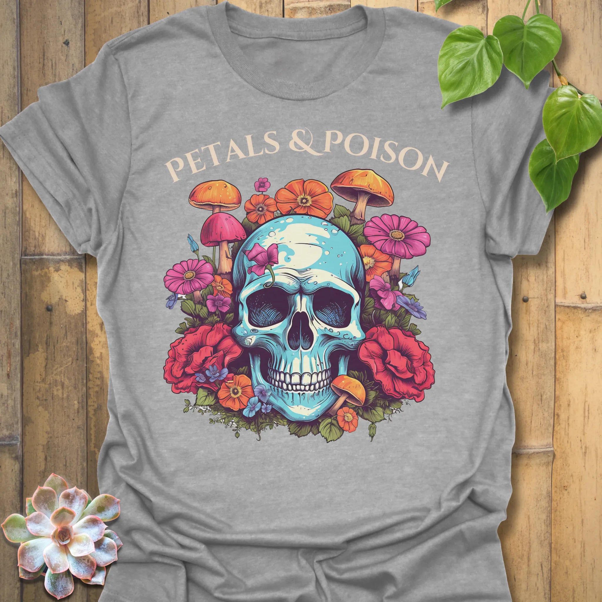 Sport Grey t-shirt featuring the design Petals & Poison printed in bold letters, gothic floral shirt.