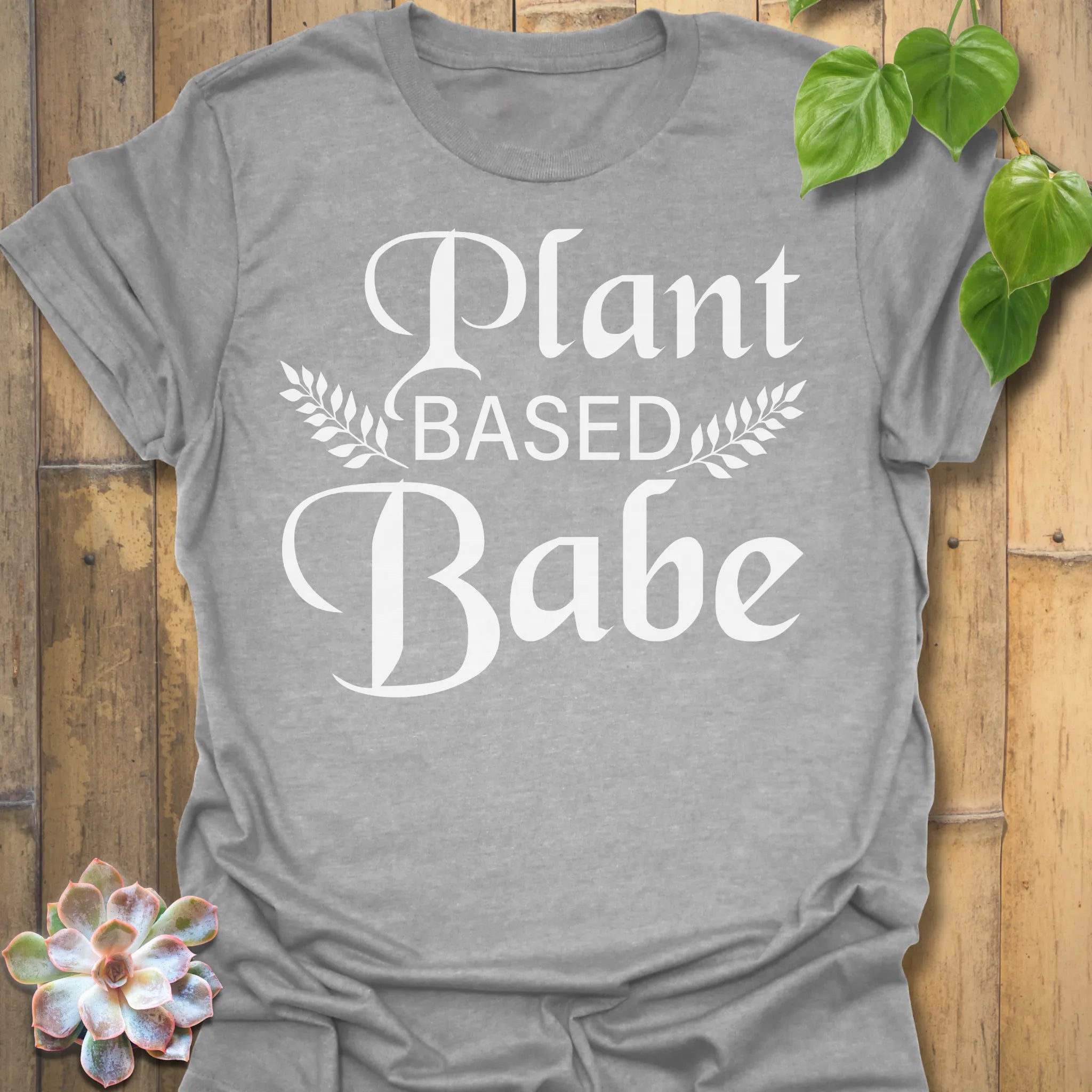 Sport Grey t-shirt featuring the design Plant Based Babe printed in bold white letters, plant lover vegan shirt.