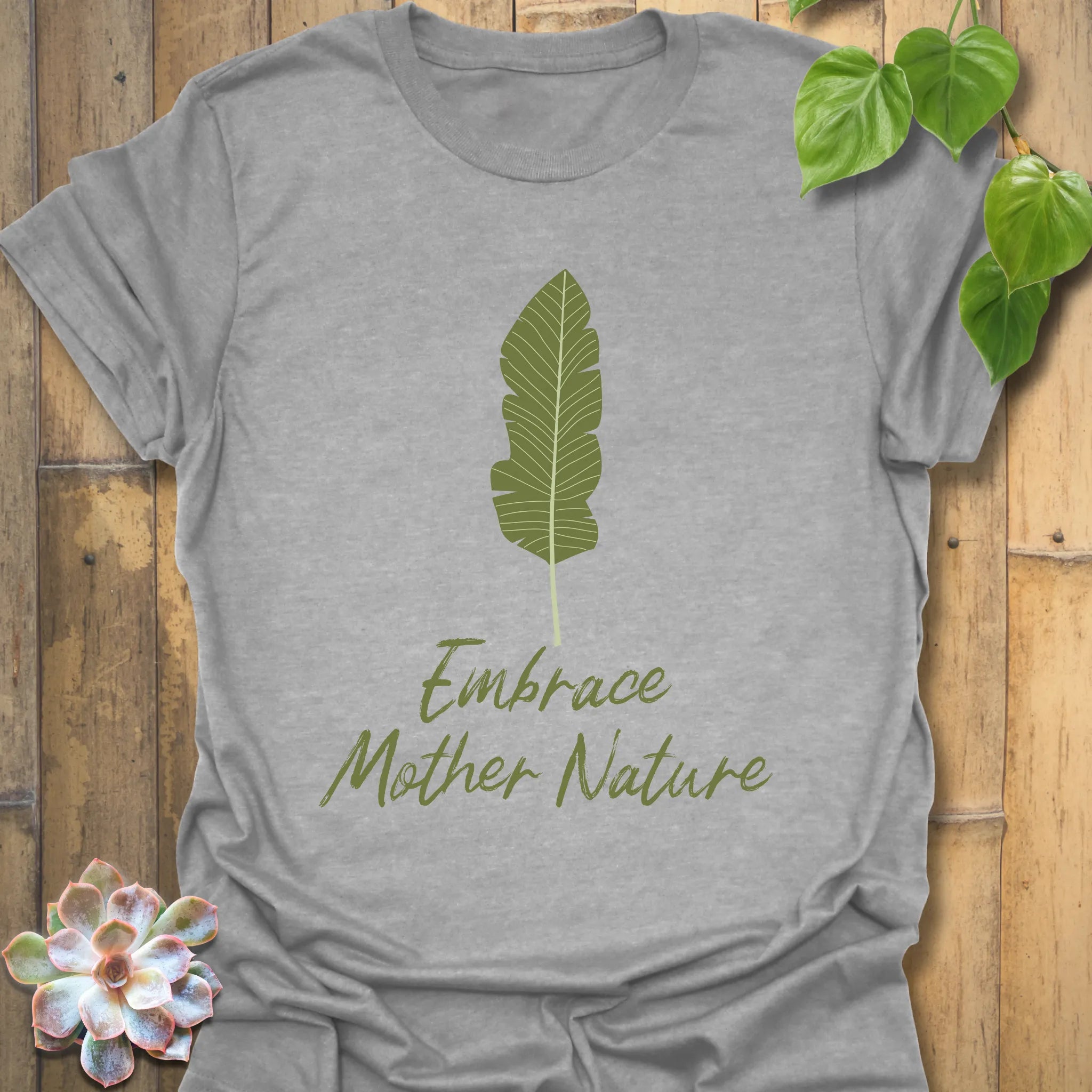 Sport grey t-shirt displaying the phrase “Embrace Mother Nature” with a simple leaf print design