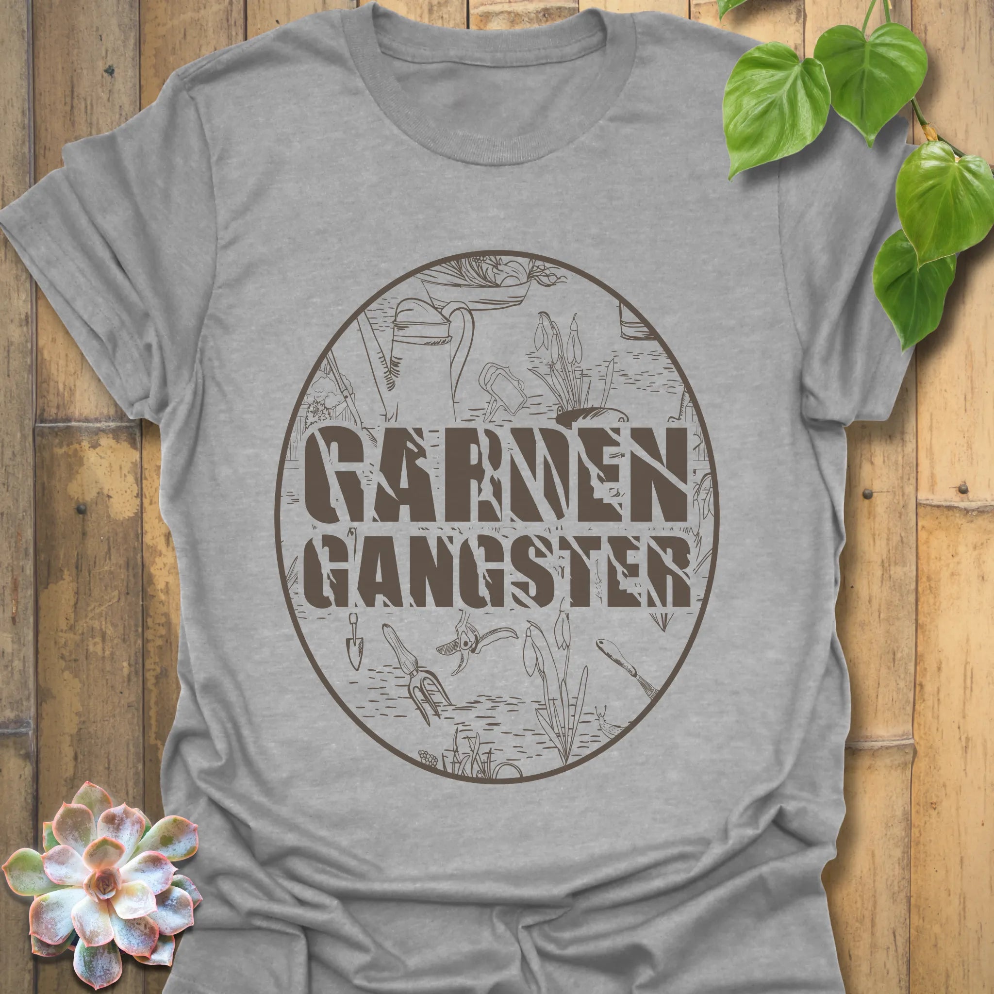 Sport grey t-shirt featuring the design Garden Gangster with printed garden tools, soft gardening graphic tee for casual outfits.