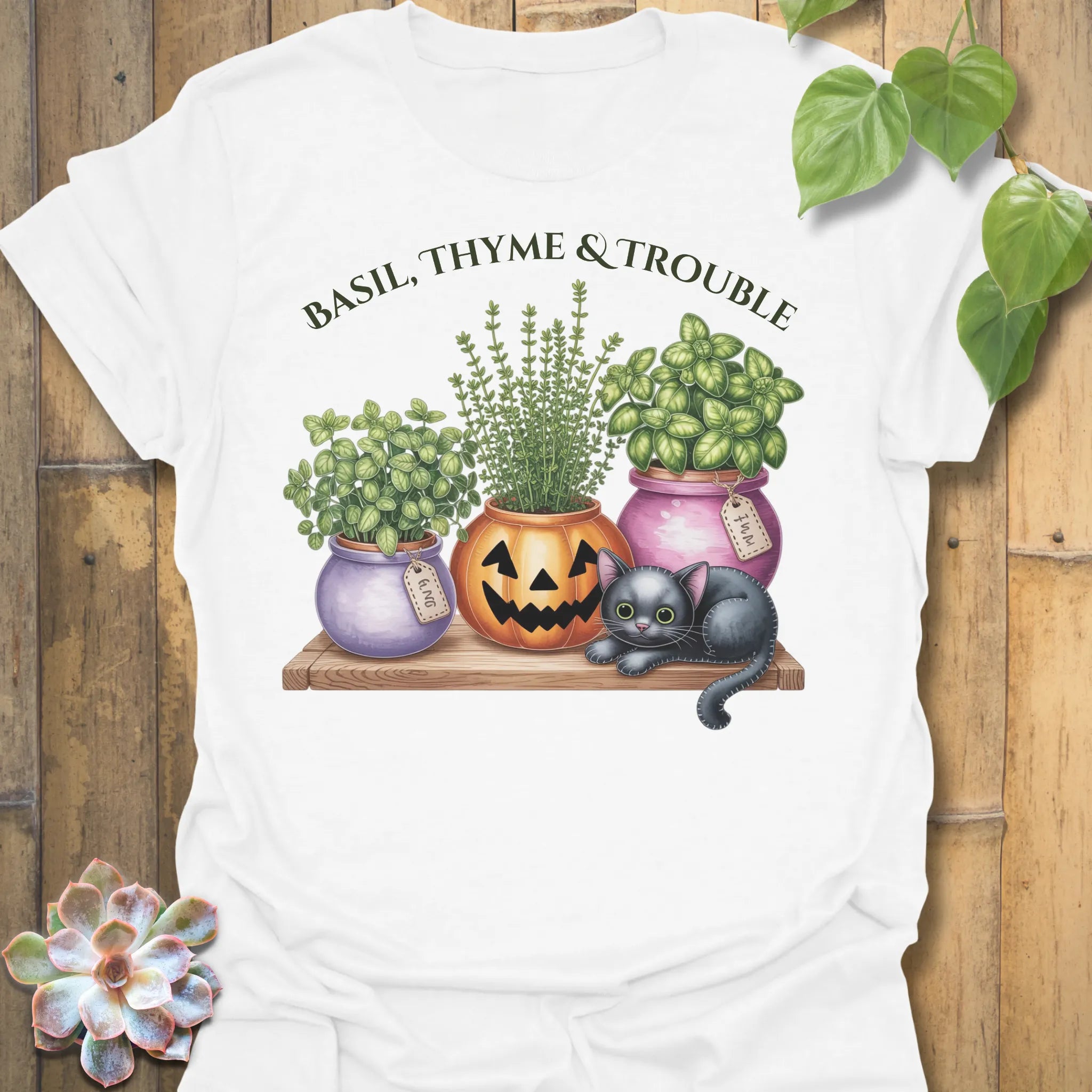 White t-shirt featuring the design Basil, Thyme & Trouble printed in bold letters, plant and herb lover tee.