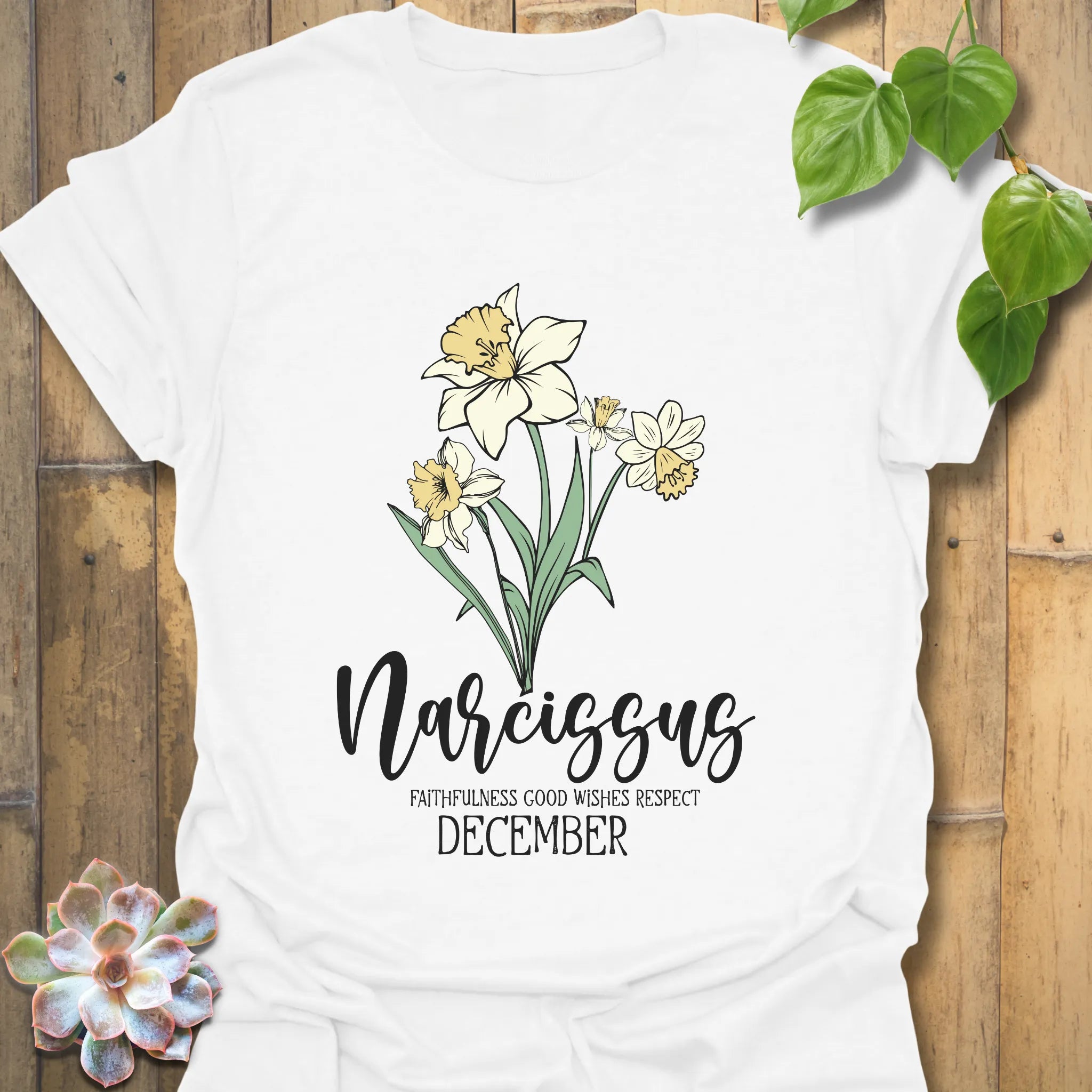 White t-shirt featuring the design December Narcissus printed with a delicate narcissus flower, perfect as a botanical flower graphic tee