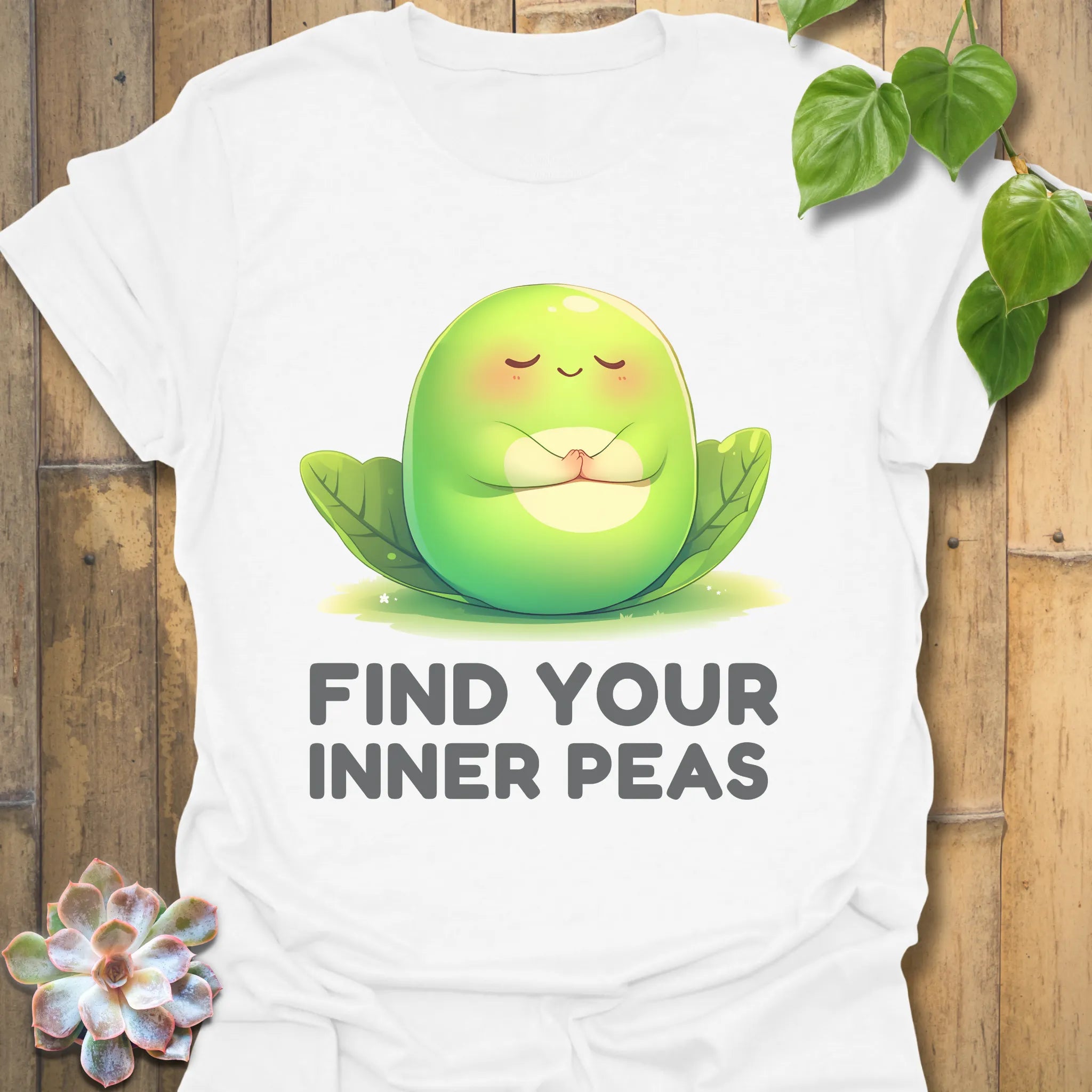 White t-shirt featuring the design Find Your Inner Peas printed in bold green letters with playful pea graphics