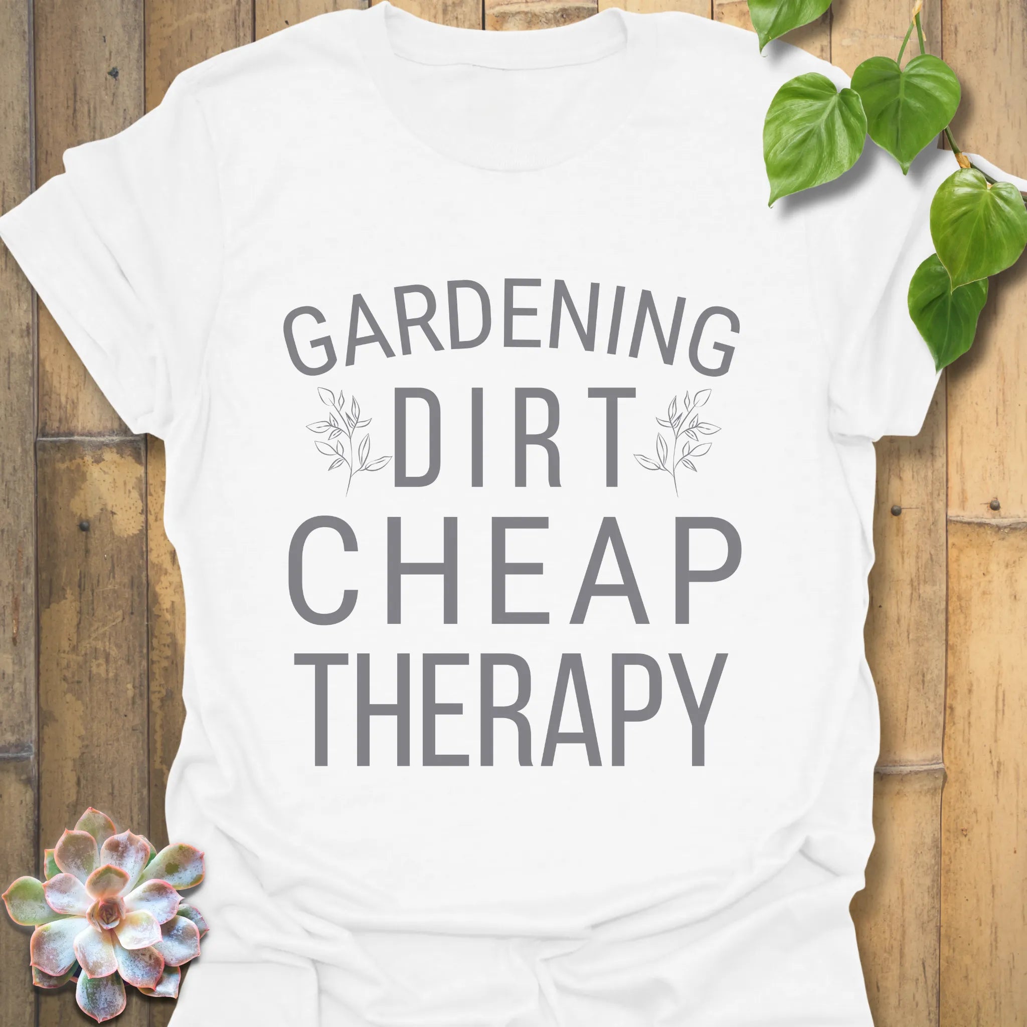 White t-shirt featuring the design Gardening Dirt Cheap Therap, perfect gardening shirt.