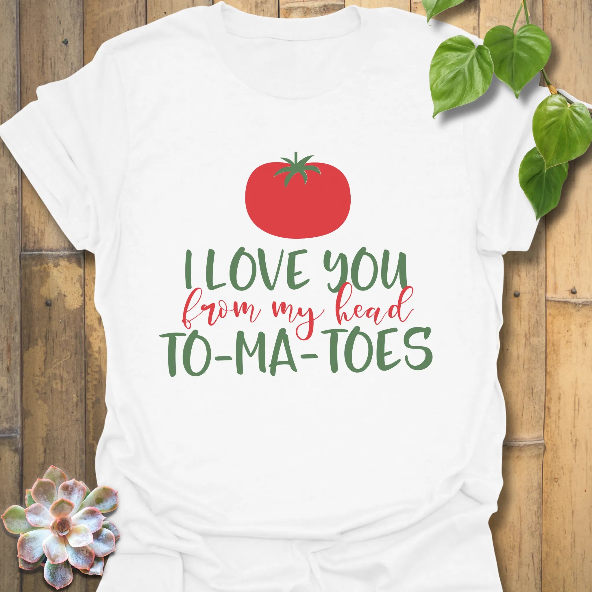 White t-shirt featuring the design I Love You From My Head TO-MA-TOES, funny vegetable graphic tee.