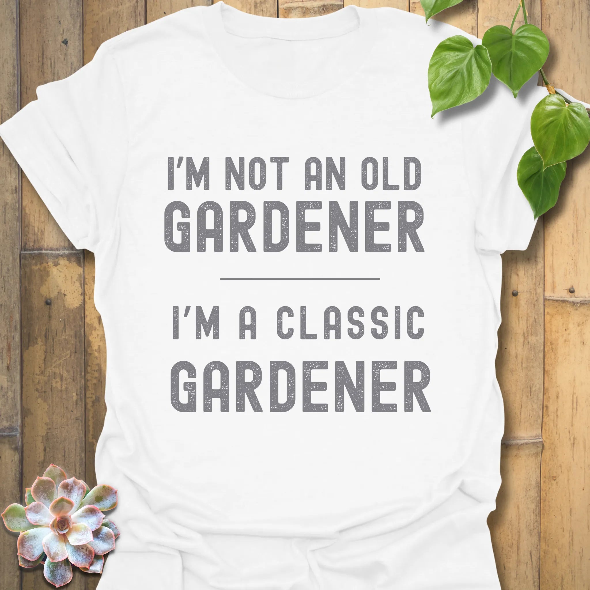 White t-shirt featuring the design “I’m not an older gardener, I’m a classic gardener” gardening humour shirt.