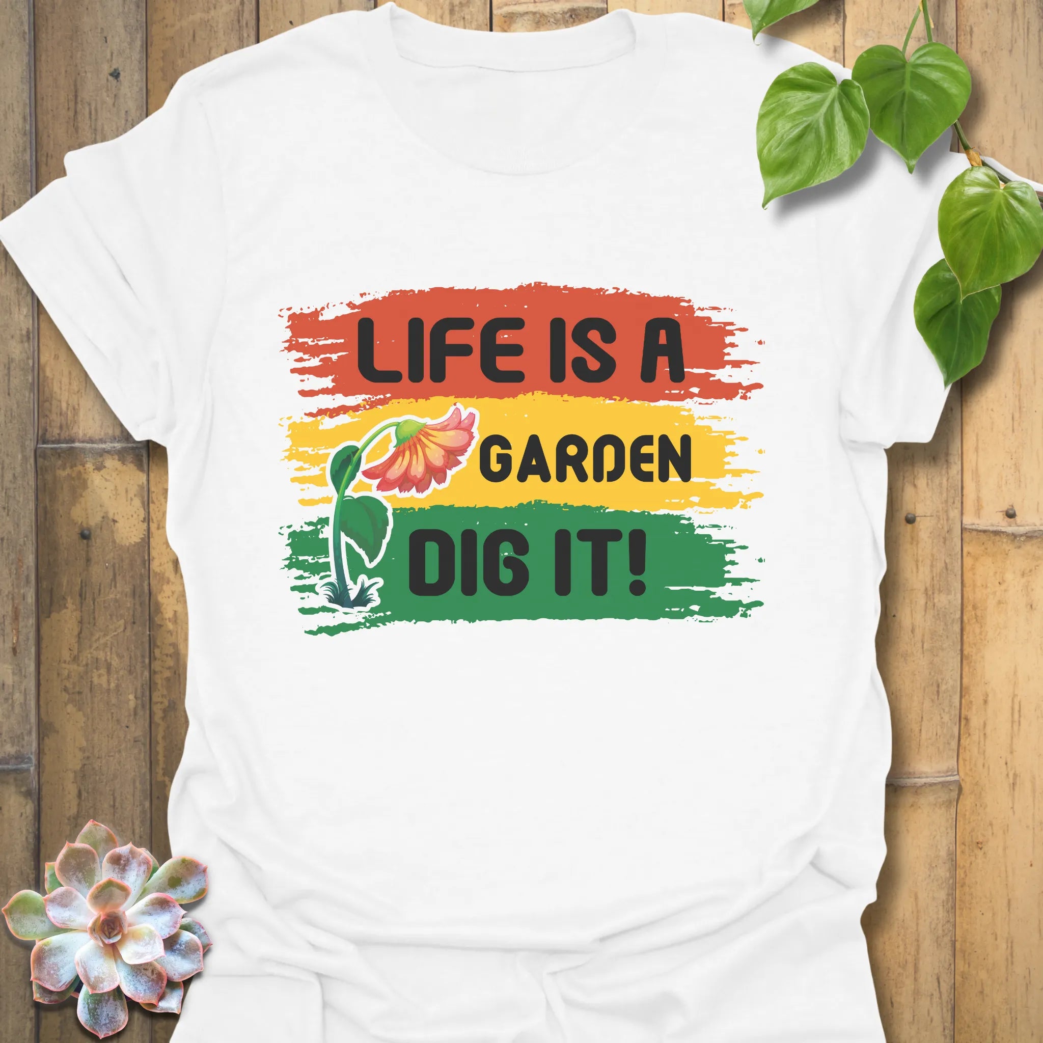White t-shirt featuring the design Life is a Garden, Dig It with bold floral gardening print.