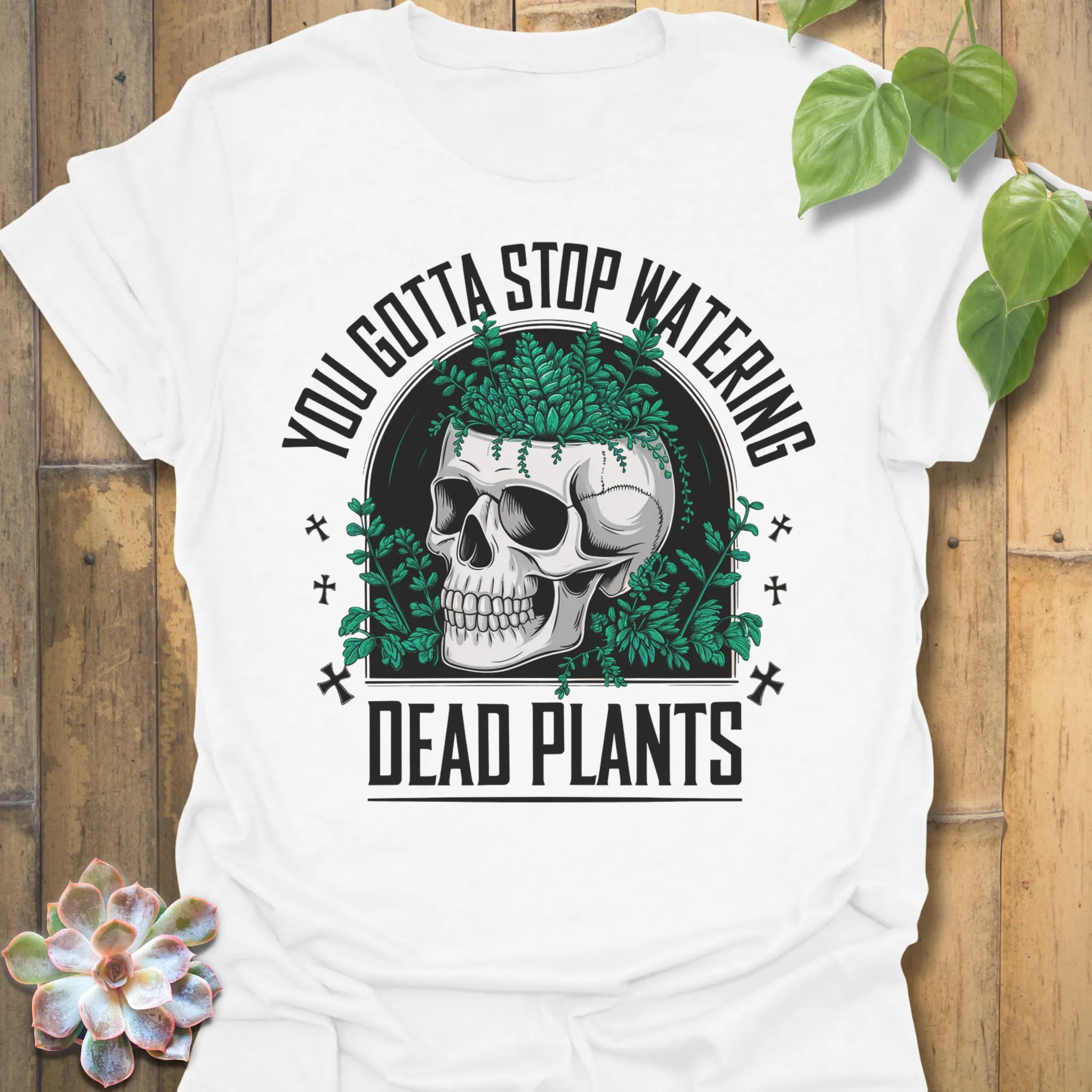 White t-shirt featuring the design Stop Watering printed in bold black letters, funny garden quote shirt
