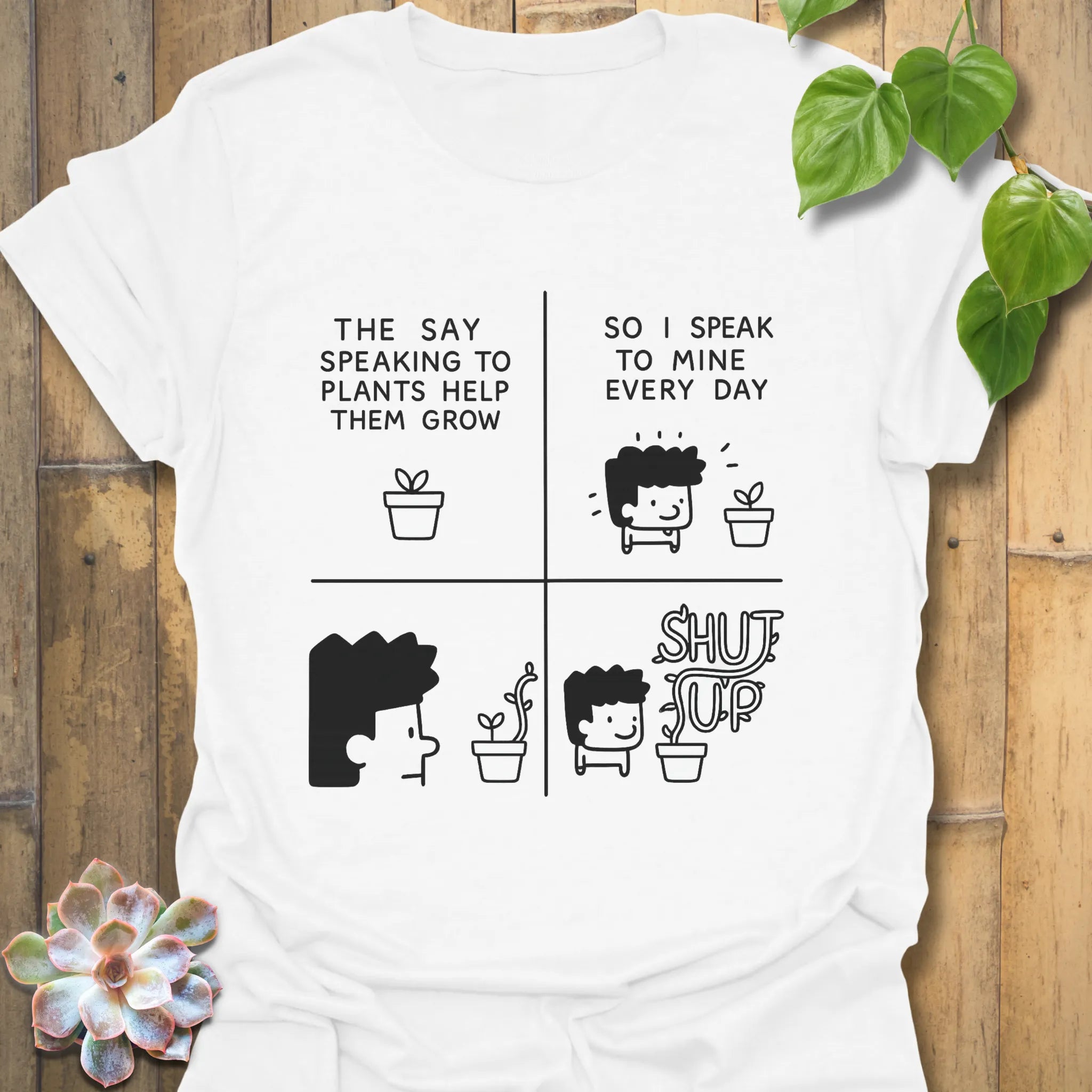 White t-shirt featuring the design “The say speaking to plants help them grow so I speak to mine everyday” with a funny character of a man and plants printed in bold colours