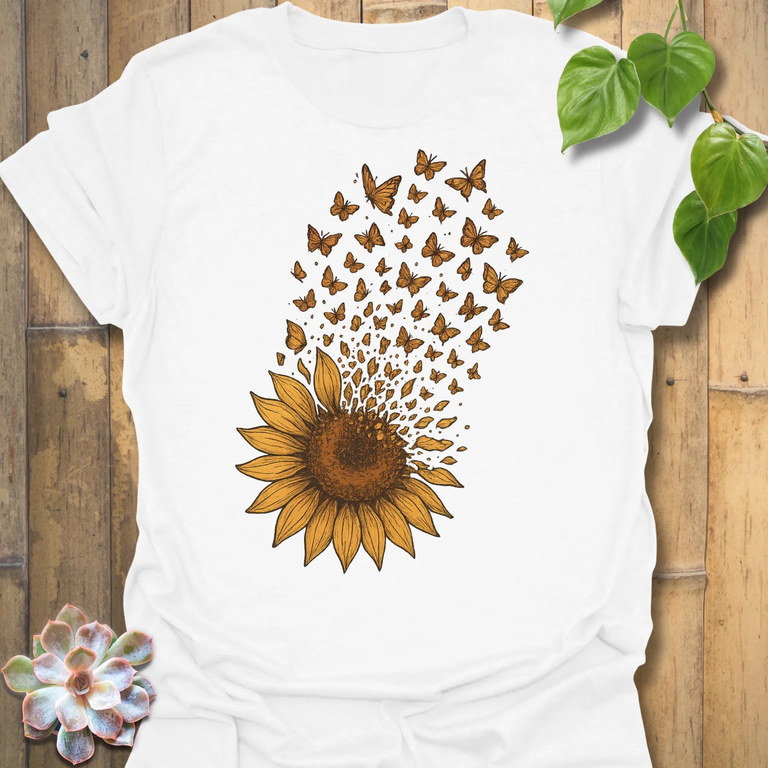 Bright and fresh, our White Sunflower Butterfly tee showcases a golden sunflower dissolving into butterflies — simple, joyful, and full of life.