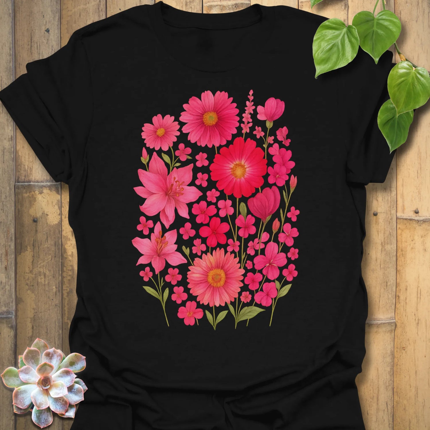 Black “Pink Blossom” T-shirt featuring bright pink floral blooms printed on soft Gildan 64000 cotton — bold and elegant for garden lovers.