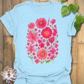 Light blue “Pink Blossom” tee showcasing bright pink flower design — lightweight, breathable Gildan 64000 cotton.
