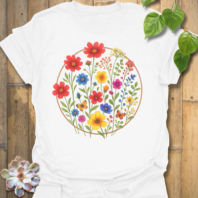 White “Circle of Flowers” T-shirt featuring a colourful circular floral design with wildflowers and butterflies, printed on soft Gildan 64000 cotton