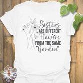White  t-shirt with floral design with saying Sisters are different flowers from the same garden