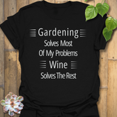 Gildan 64000 Black unisex t-shirt with bold white quote ‘Gardening solves most of my problems, wine solves the rest.’ Comfortable everyday fit
