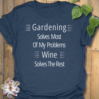 Gildan 64000 t-shirt in Heather Navy with white text that reads ‘Gardening solves most of my problems, wine solves the rest.’ Soft unisex fit.
