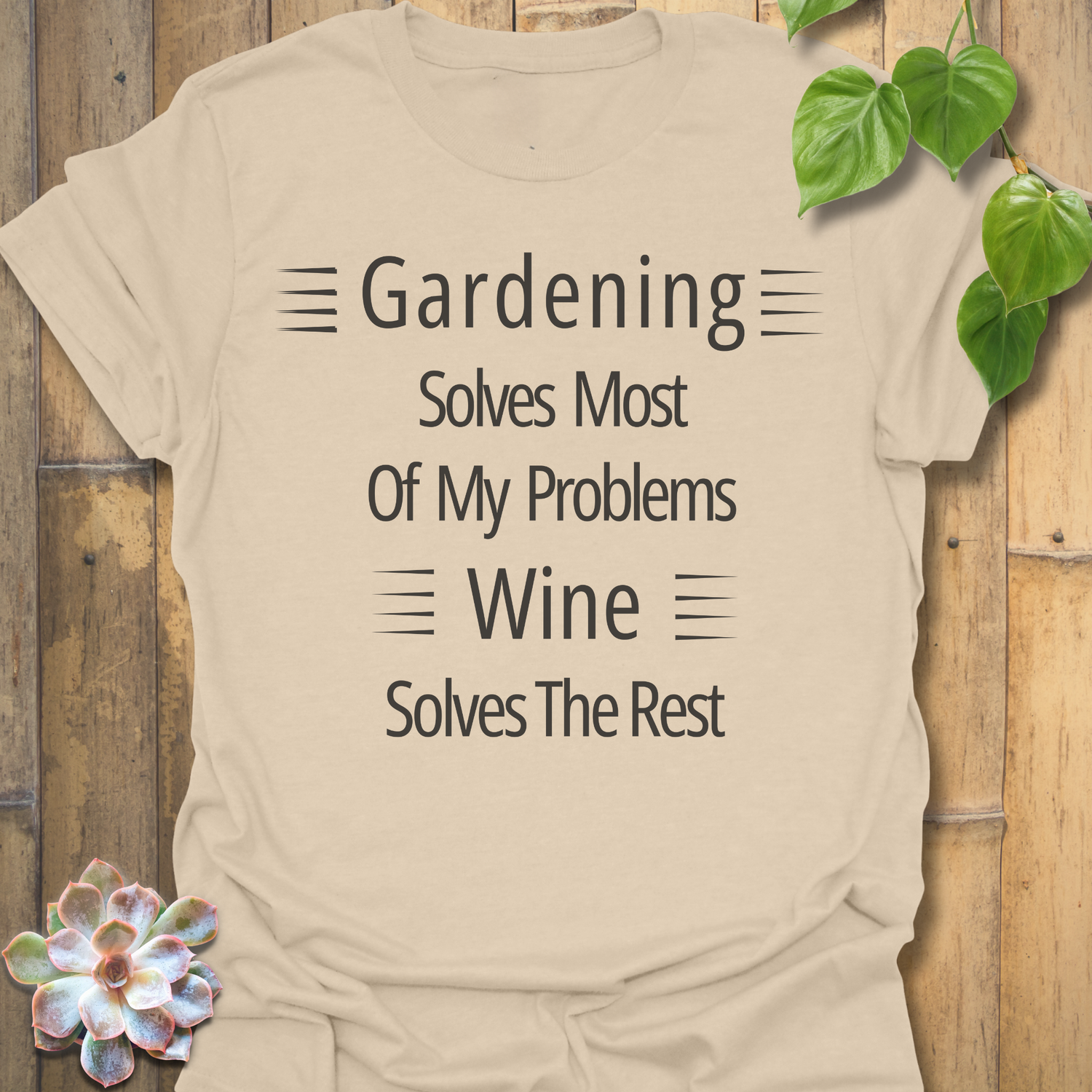 Gildan 64000 Sand colour t-shirt with white lettering that says ‘Gardening solves most of my problems, wine solves the rest.’ Unisex fit with warm neutral tone.