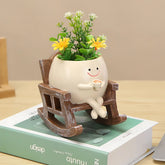 Swinging plant pot