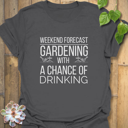 Charcoal-coloured unisex T-shirt with white text reading “Gardening solves most of my problems, wine solves the rest,” displayed flat on a wooden background with a succulent plant beside it.