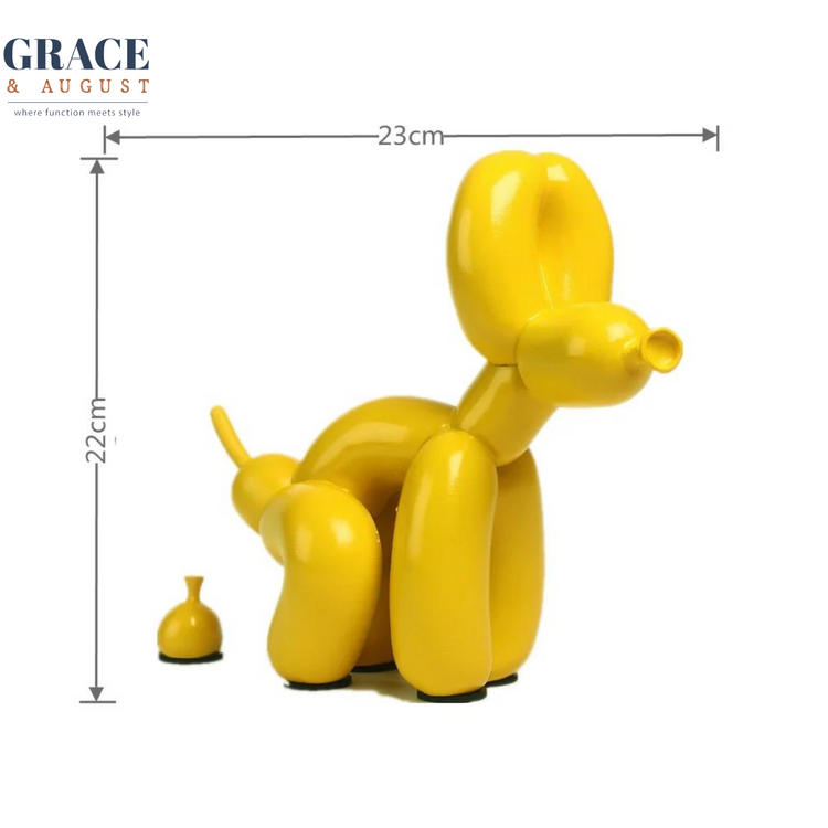 yellow resin balloon dog pooping