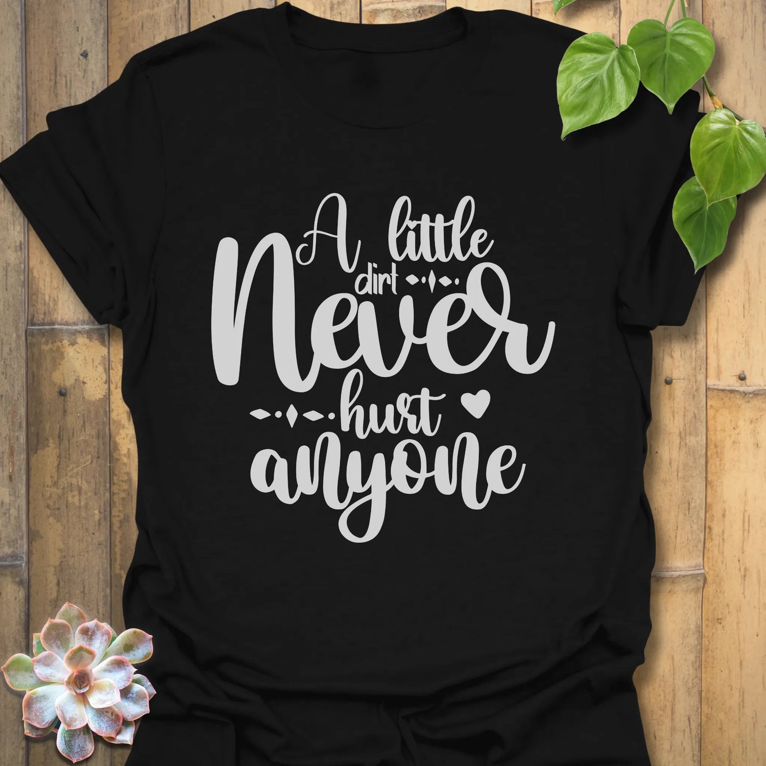 Black gardening graphic tee featuring the design A Little Dirt Never Hurt Anyone in bold white print.