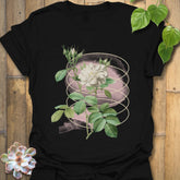 Black t-shirt featuring the Blossom Whisper design with a detailed flower illustration on the front