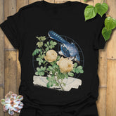 Black t-shirt featuring the Botanical Flight design with a bird and flower print