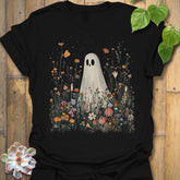 Black t-shirt featuring the design Among The Wildflowers printed in halloween floral graphic tee.