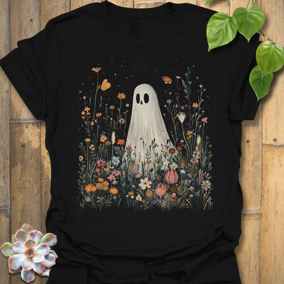 Black t-shirt featuring the design Among The Wildflowers printed in halloween floral graphic tee.