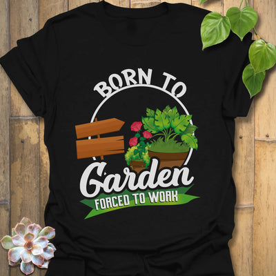 Black t-shirt featuring the design Born to Garden Forced to Work with a print of garden tools and potted plants