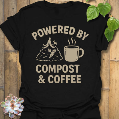 Black t-shirt featuring the design Compost &amp; Coffee printed in bold letters, eco-conscious garden tee.