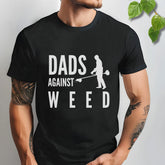 Black t-shirt featuring the design Dad Against Weeds, funny father’s gardening shirt.