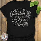 Black t-shirt featuring the design Garden And The Rose printed in soft floral tones, stylish plant lover shirt.