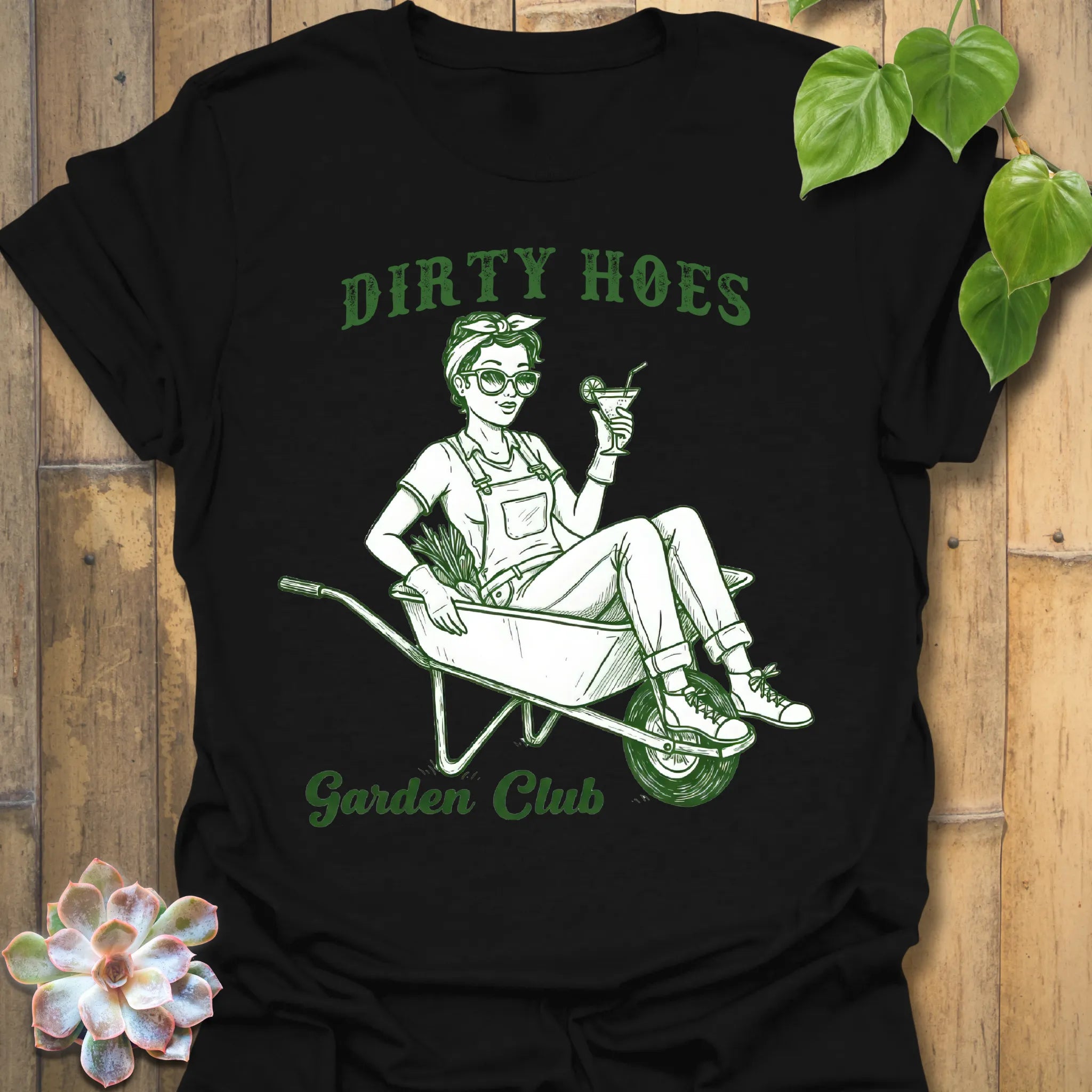 Black t-shirt featuring the design Garden Club printed in bold green letters, garden lover t-shirt.