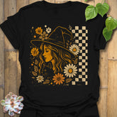 Black t-shirt featuring the design Garden Witch Vibes printed in  witchy garden shirt.