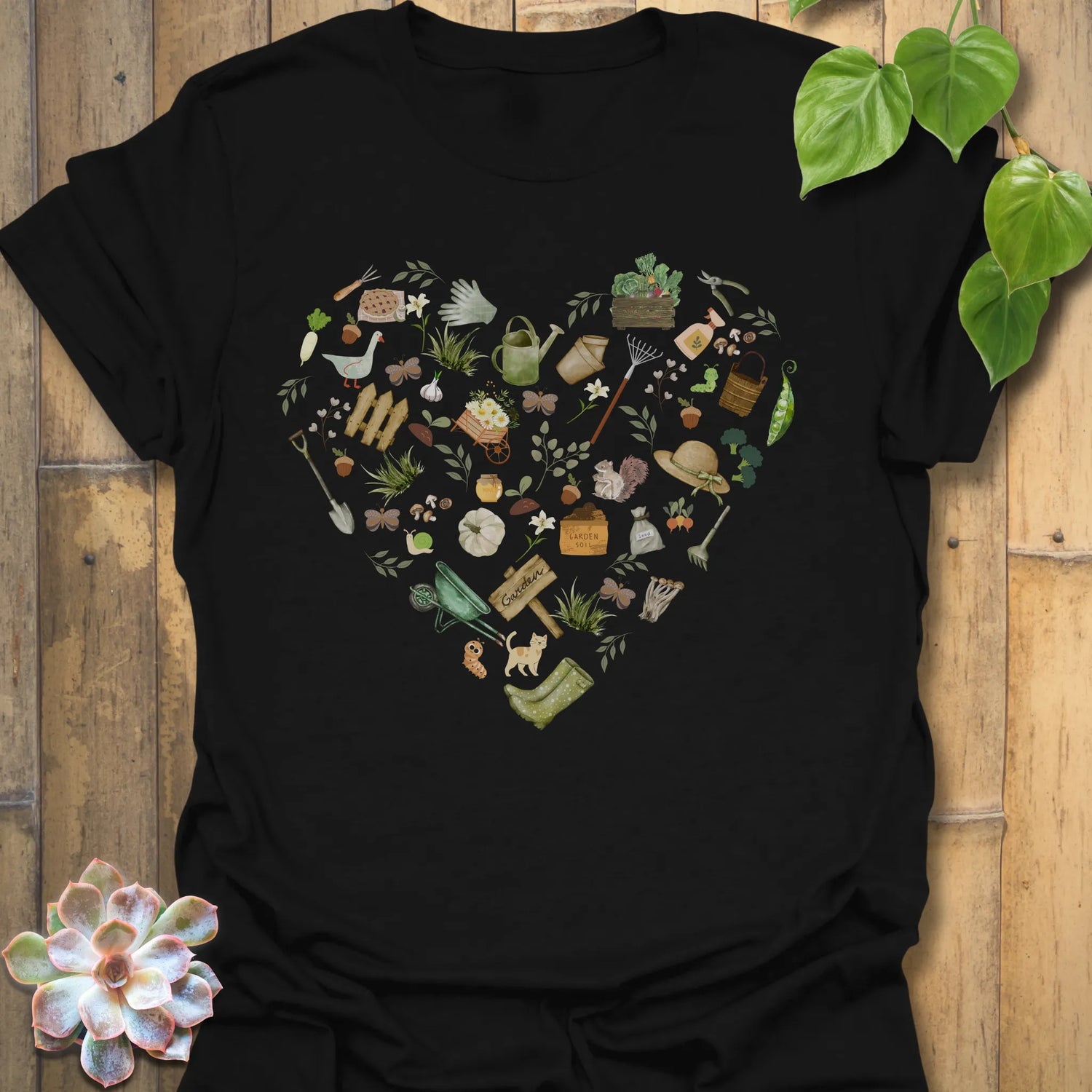 Black t-shirt featuring the design Gardening Loveheart printed in gardening graphic, perfect for plant lovers.
