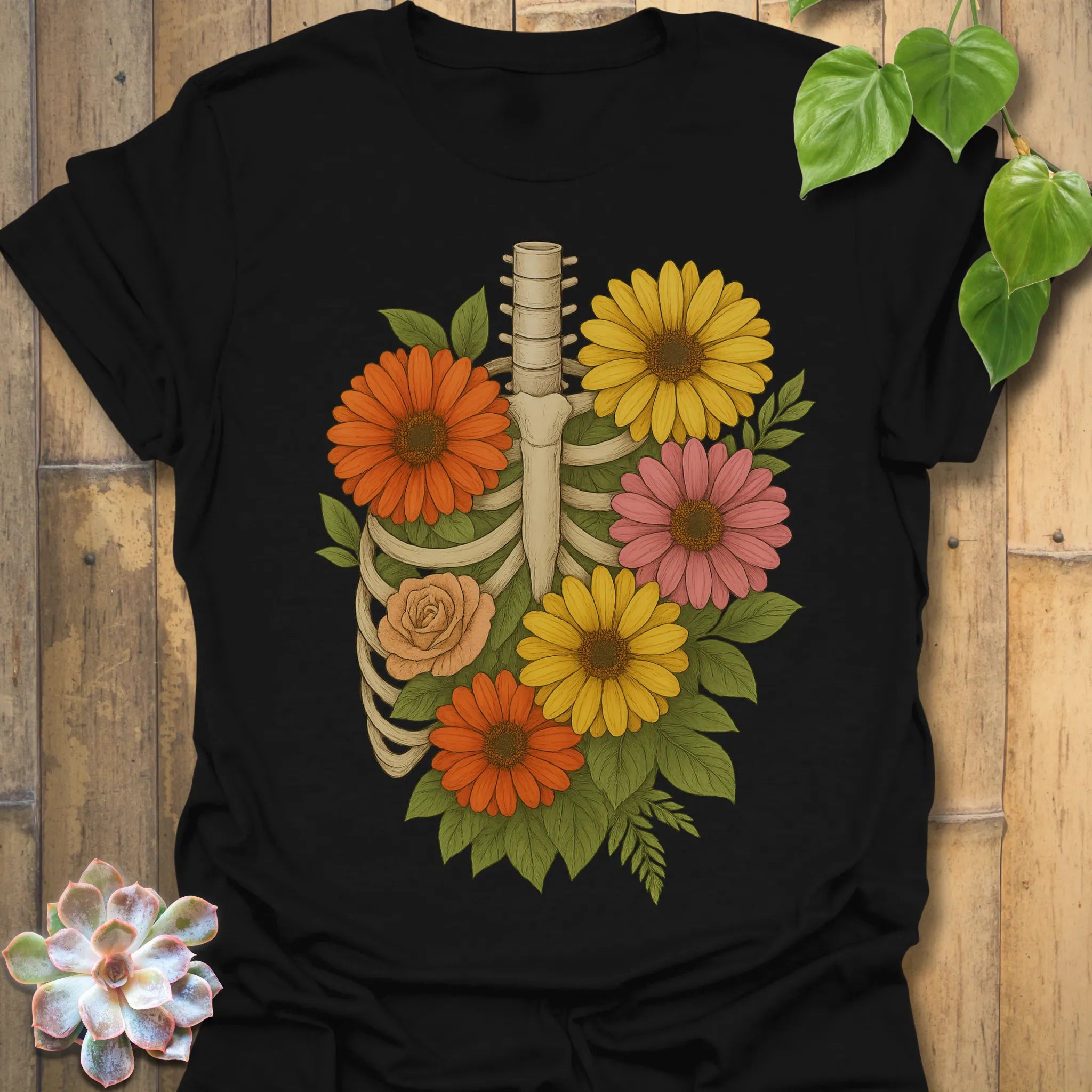 Black t-shirt featuring the design Gerbera Bones printed in floral skeleton graphic tee.
