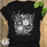Black t-shirt featuring the design God Is Good printed in black letters, religious faith shirt.