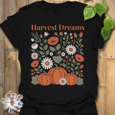 Black t-shirt featuring the design Harvest Dreams printed in bold orange letters, cosy harvest tee.